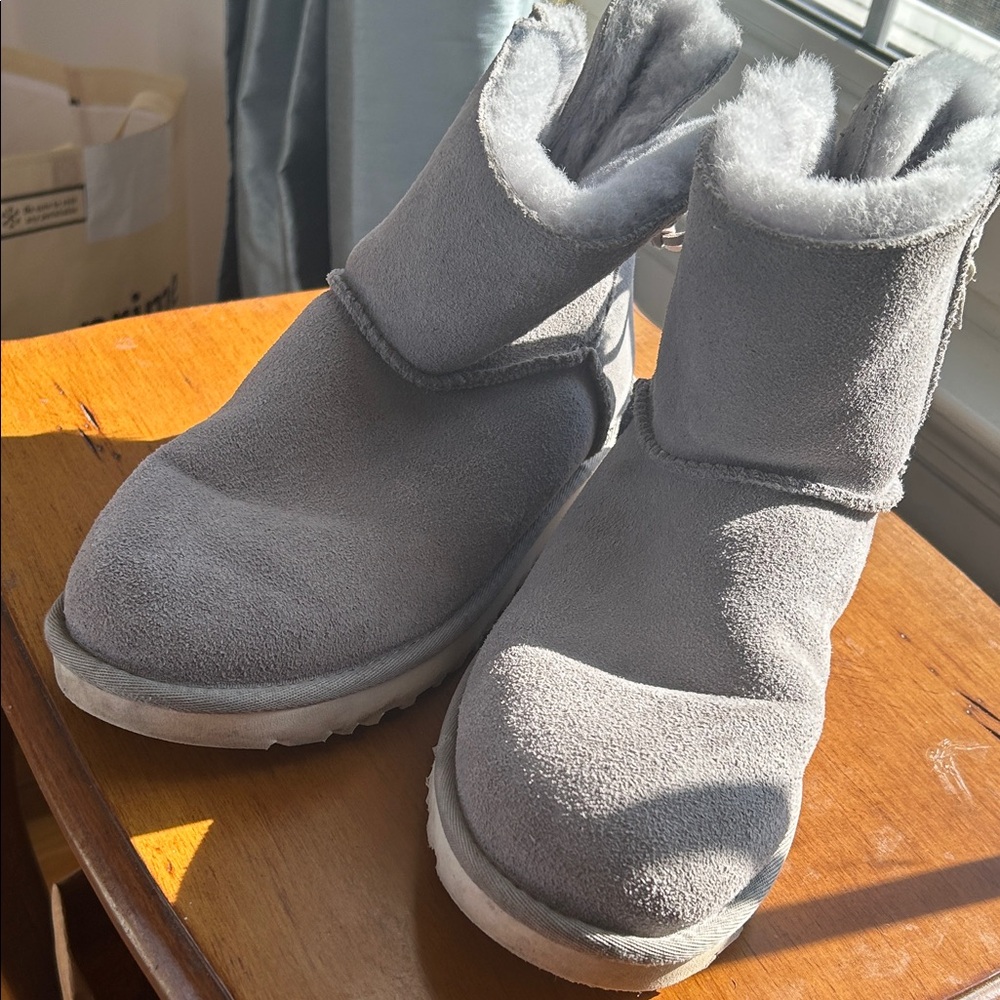 Grey UGG boots leather ties in faux fur lined in good condition